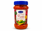A jar of Muralis Mango Thokku Pickle with a blue screw cap and a red and white label, set against a plain white background.