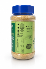 A clear plastic jar of COCO Goodness of Almond & Cashew Sweetened with Brown Sugar, featuring a bright blue lid and a green label with product details, set against a plain white background.