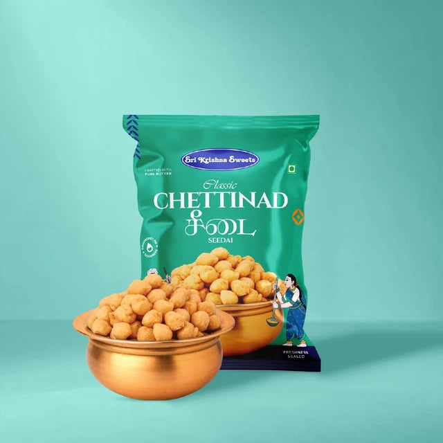 A green bag of Classic Chettinad Vellai snack, shown with two copper bowls filled with golden-brown chettinad balls on a solid teal background.