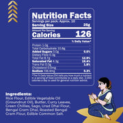 A blue nutrition facts label design with a white Nutrition Facts box, serving size 25g, 126 calories, and a list of ingredients including rice flour, edible vegetable oil, butter, curry leaves, green chilies, sago, urad dal flour, bengal gram dhal, roasted bengal gram flour, and edible common salt. A seated woman illustration appears in the bottom right corner.