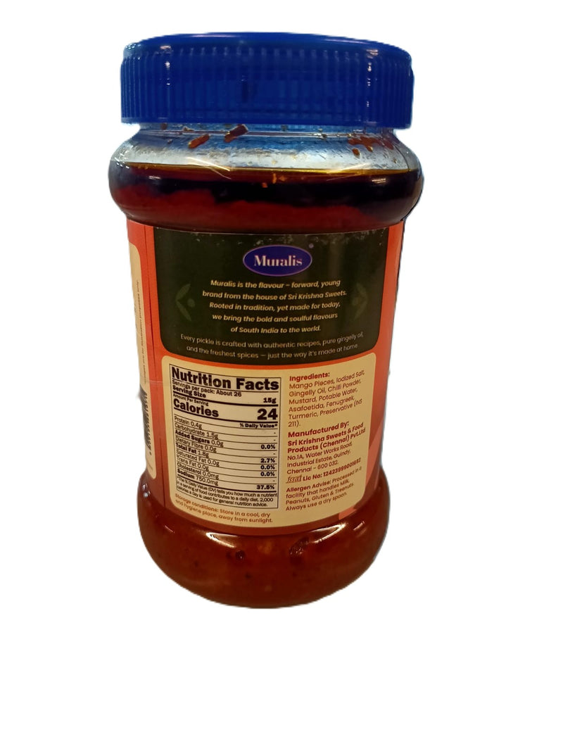 Jar of Muralis kalyana mango pickle back with a blue lid on a white background