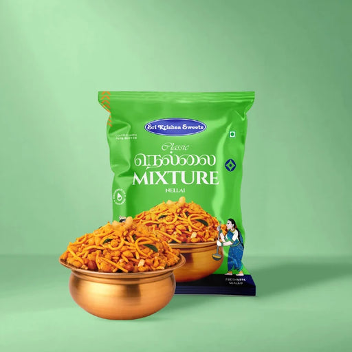 A green bag of Sri Krishnan Swetha Kerala Vellalai Mixture (Puzhai) is shown with two copper bowls filled with the orange-red spicy snack mixture in front of it, set against a solid light green background.
