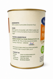 A cylindrical metal can of Muralis Avram Poo (Cassia auriculata) powder, showing the back label with ingredients, usage, and contact details, on a white background.