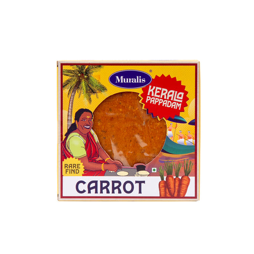 Carrot Pappadam box with orange pappadam visible through the front window and traditional Kerala artwork