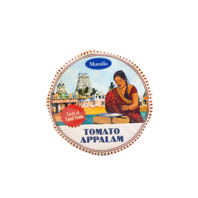 Packaging for Muralis Tomato Appalam, showing a woman preparing food on the cover, with the product name and weight (200gms) displayed.